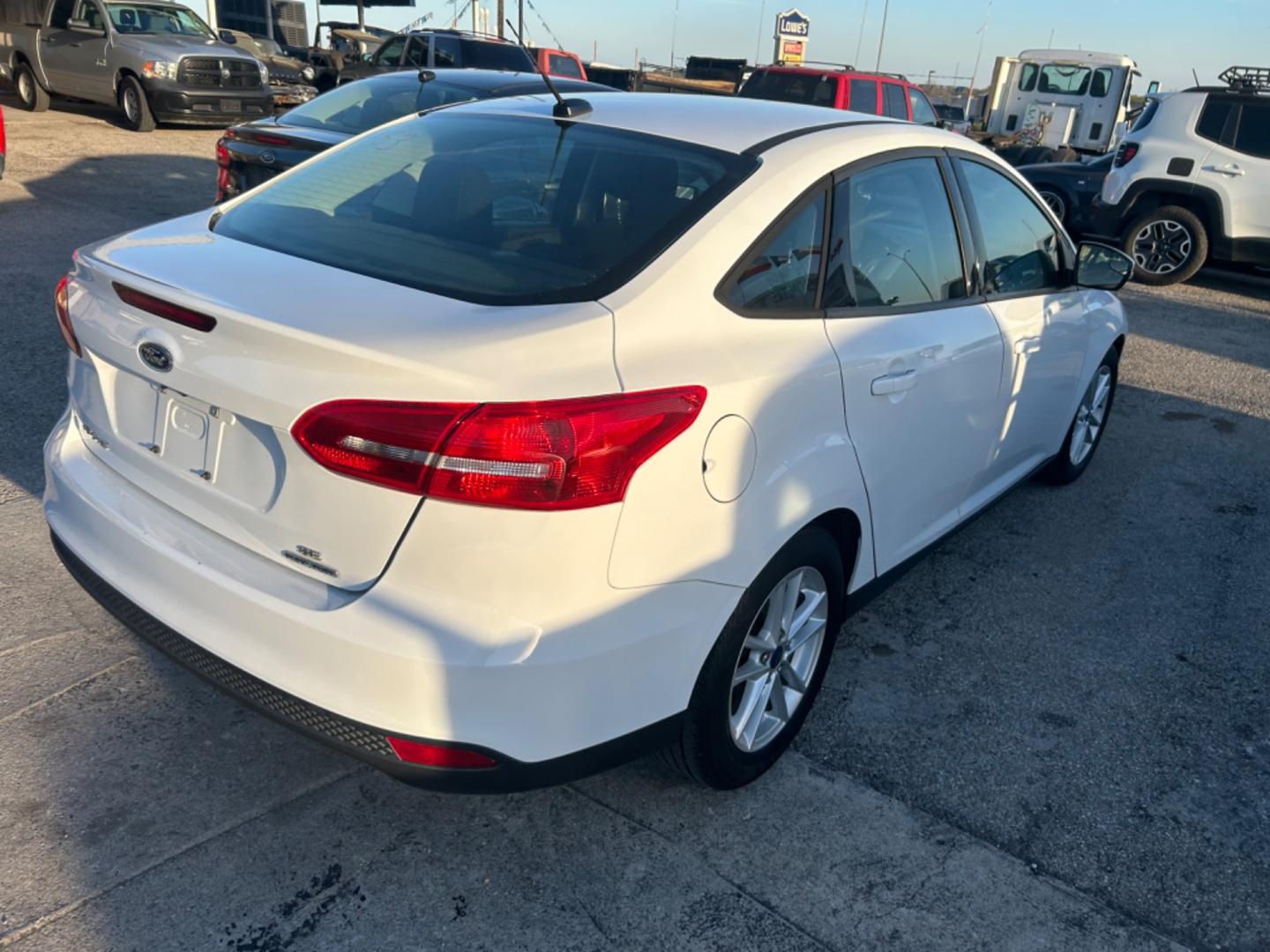 2016 White Ford Focus SE Sedan (1FADP3F28GL) with an 2.0L L4 DOHC 16V engine, located at 1687 Business 35 S, New Braunfels, TX, 78130, (830) 625-7159, 29.655487, -98.051491 - Photo#6